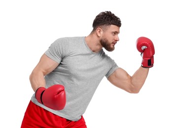 Photo of Man in boxing gloves fighting on white background