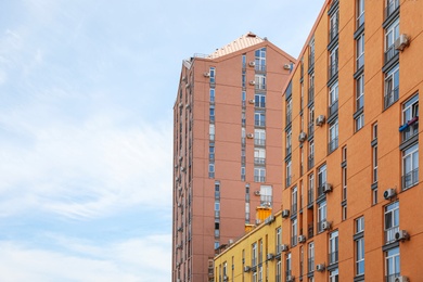 Modern buildings with windows against sky. Urban architecture