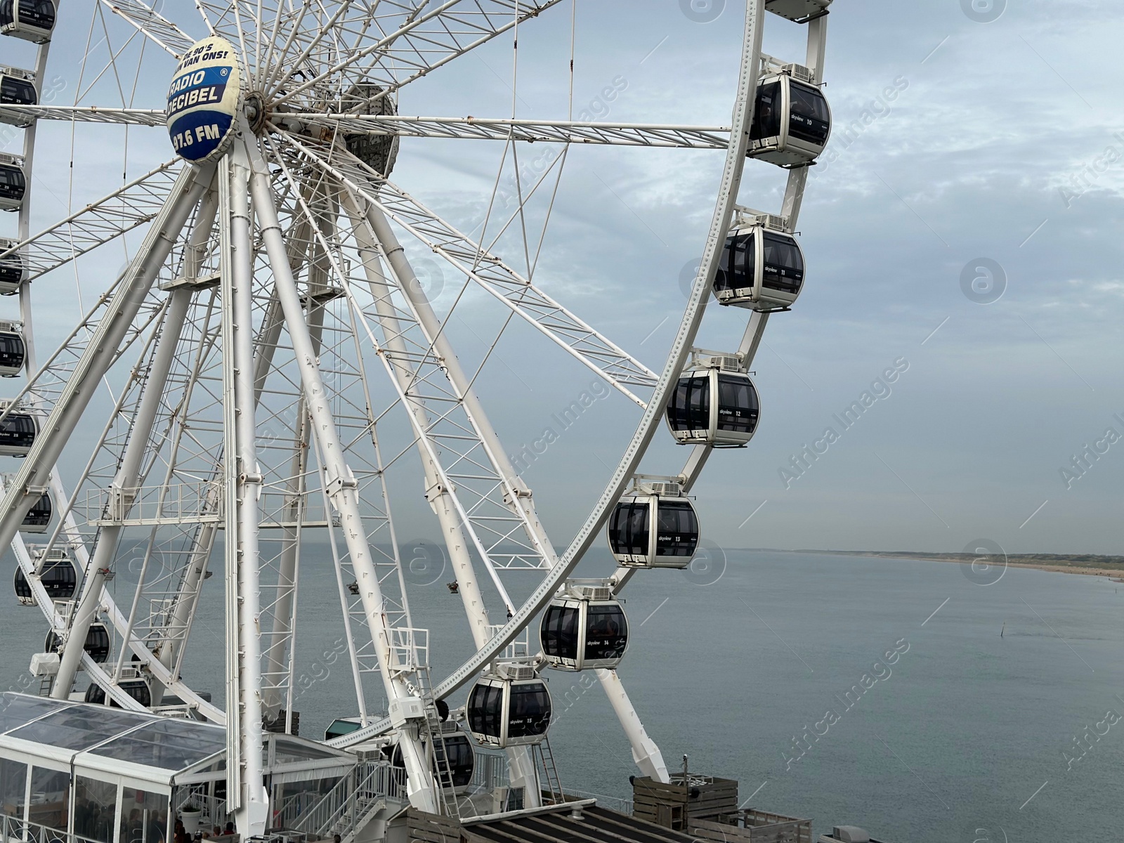 Photo of HAGUE, NETHERLANDS - OCTOBER 29, 2022: Beautiful Ferris wheel at Scheveningen beach