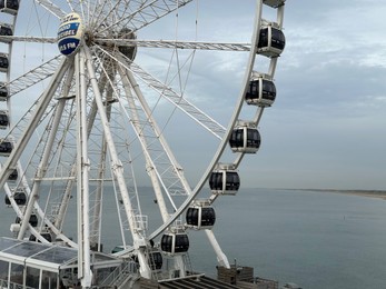 HAGUE, NETHERLANDS - OCTOBER 29, 2022: Beautiful Ferris wheel at Scheveningen beach