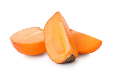 Pieces of delicious ripe juicy persimmons on white background