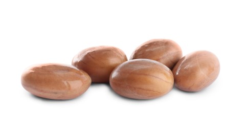 Photo of Many raw jackfruit seeds on white background