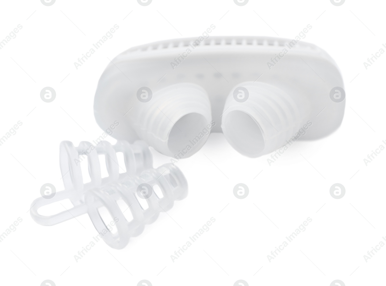 Photo of Different anti-snoring devices for nose on white background