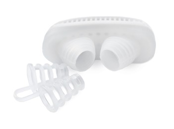 Photo of Different anti-snoring devices for nose on white background