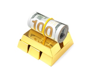 Photo of Shiny gold bars and money on white background