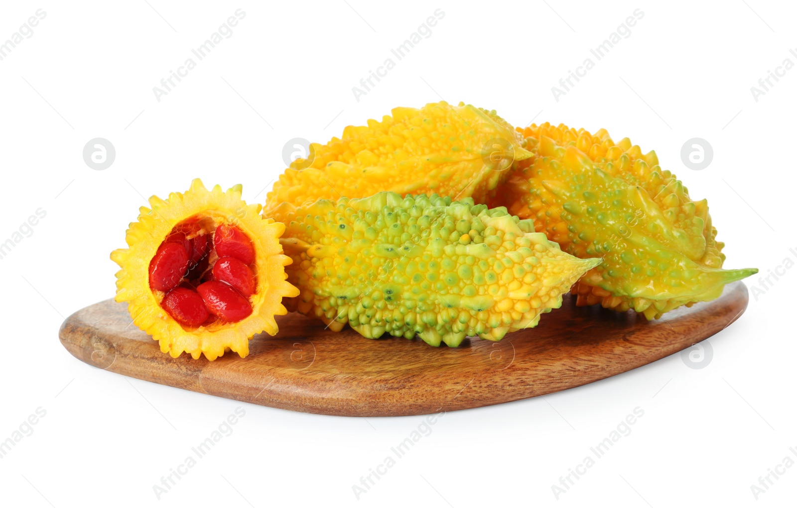 Photo of Fresh ripe bitter melons on white background