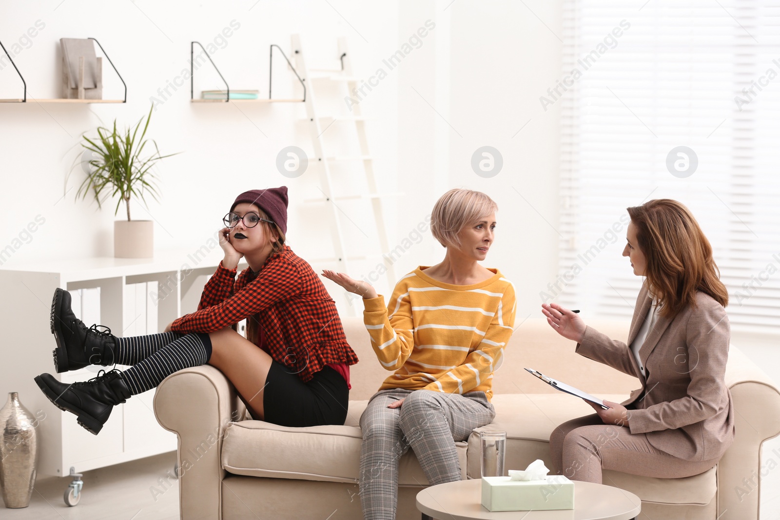 Photo of Woman complaining about difficult daughter in psychotherapist office