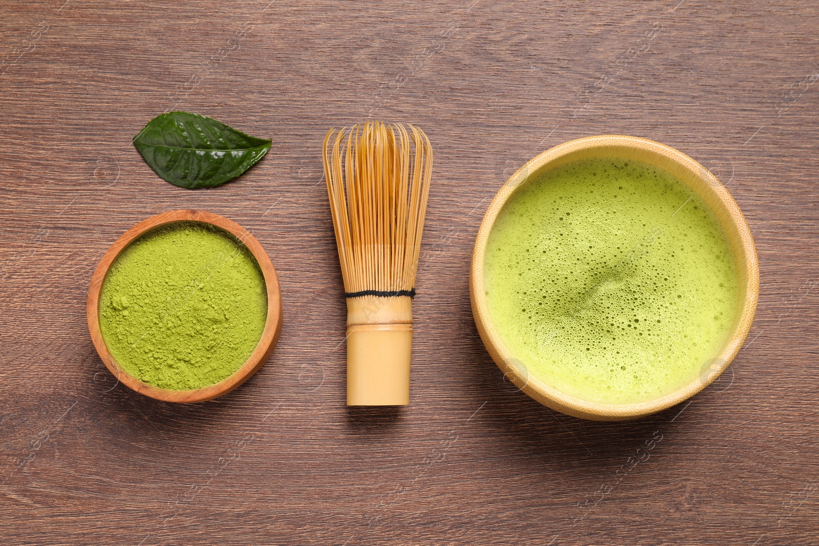 Photo of Flat lay composition with matcha tea on wooden table
