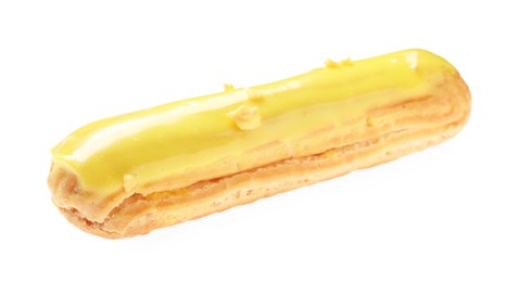 Photo of Delicious eclair covered with yellow glaze isolated on white