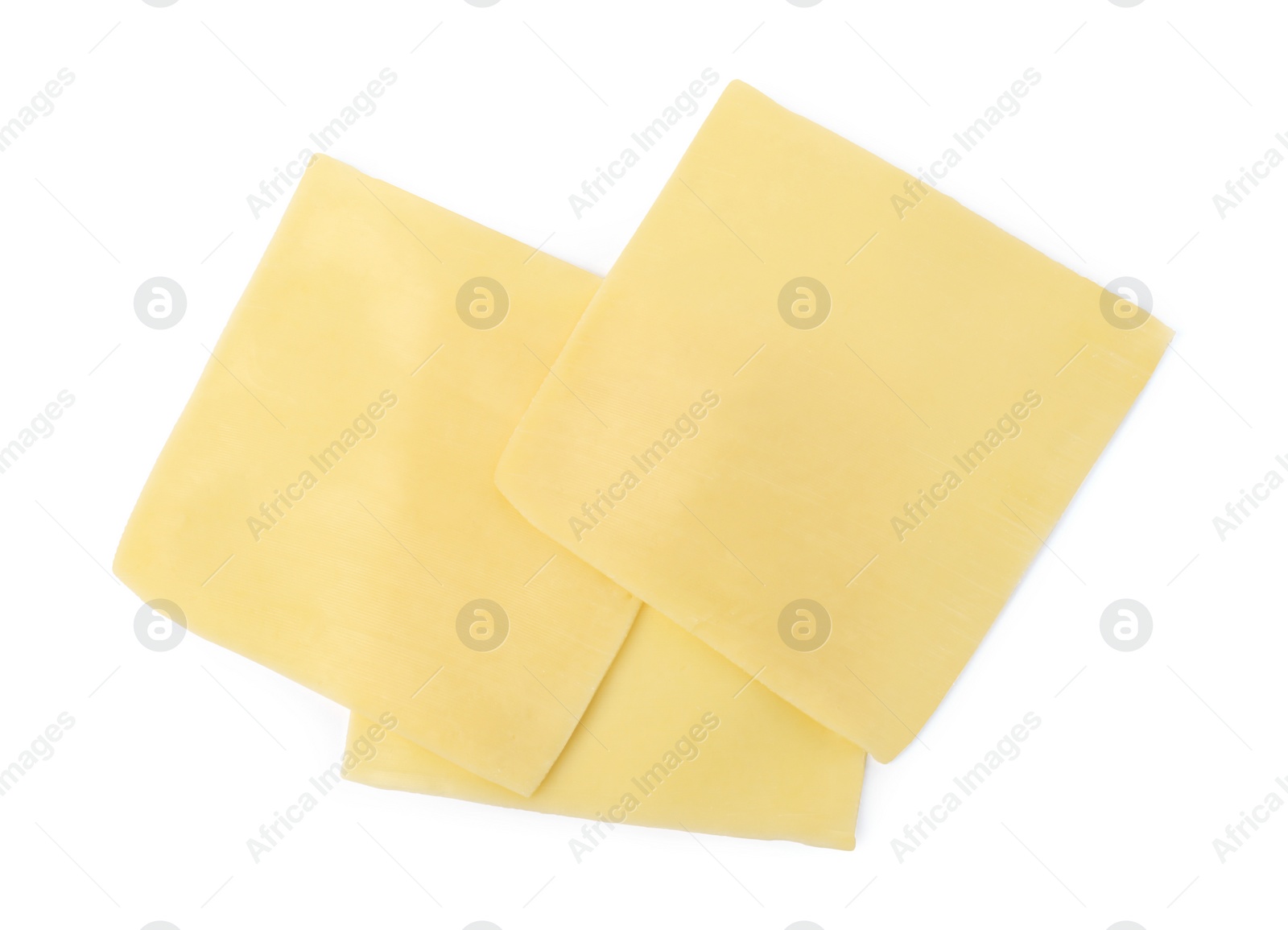 Photo of Slices of tasty fresh cheese isolated on white, top view