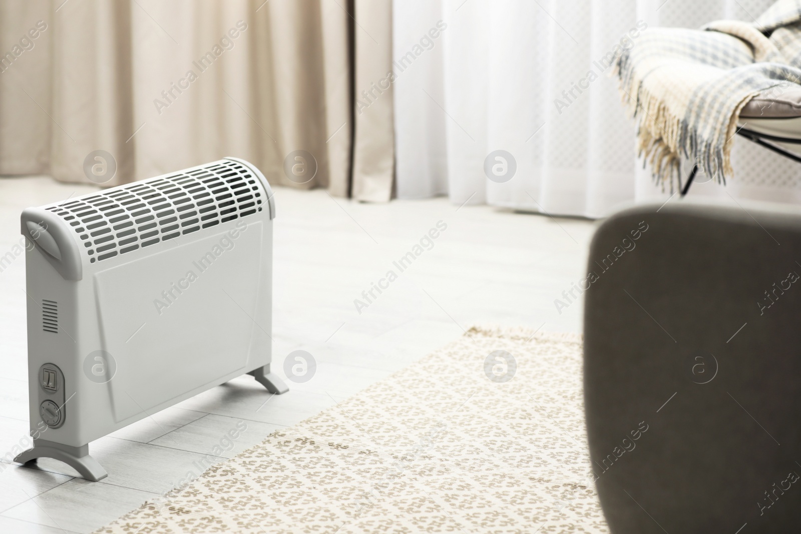 Image of Modern electric heater in stylish room interior