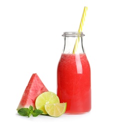 Tasty summer watermelon drink in bottle and slices of fresh fruits on white background