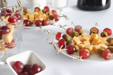 Photo of Delicious snacks on white table. Coffee break
