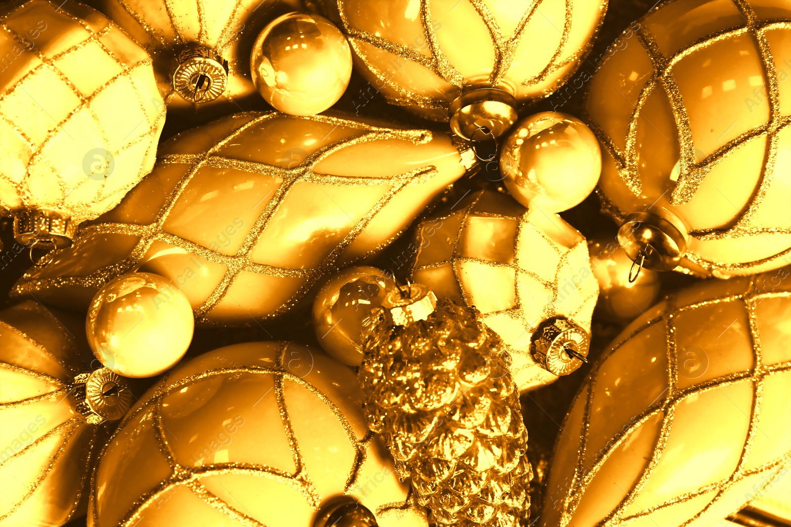 Image of Many shiny golden Christmas tree baubles as background, closeup