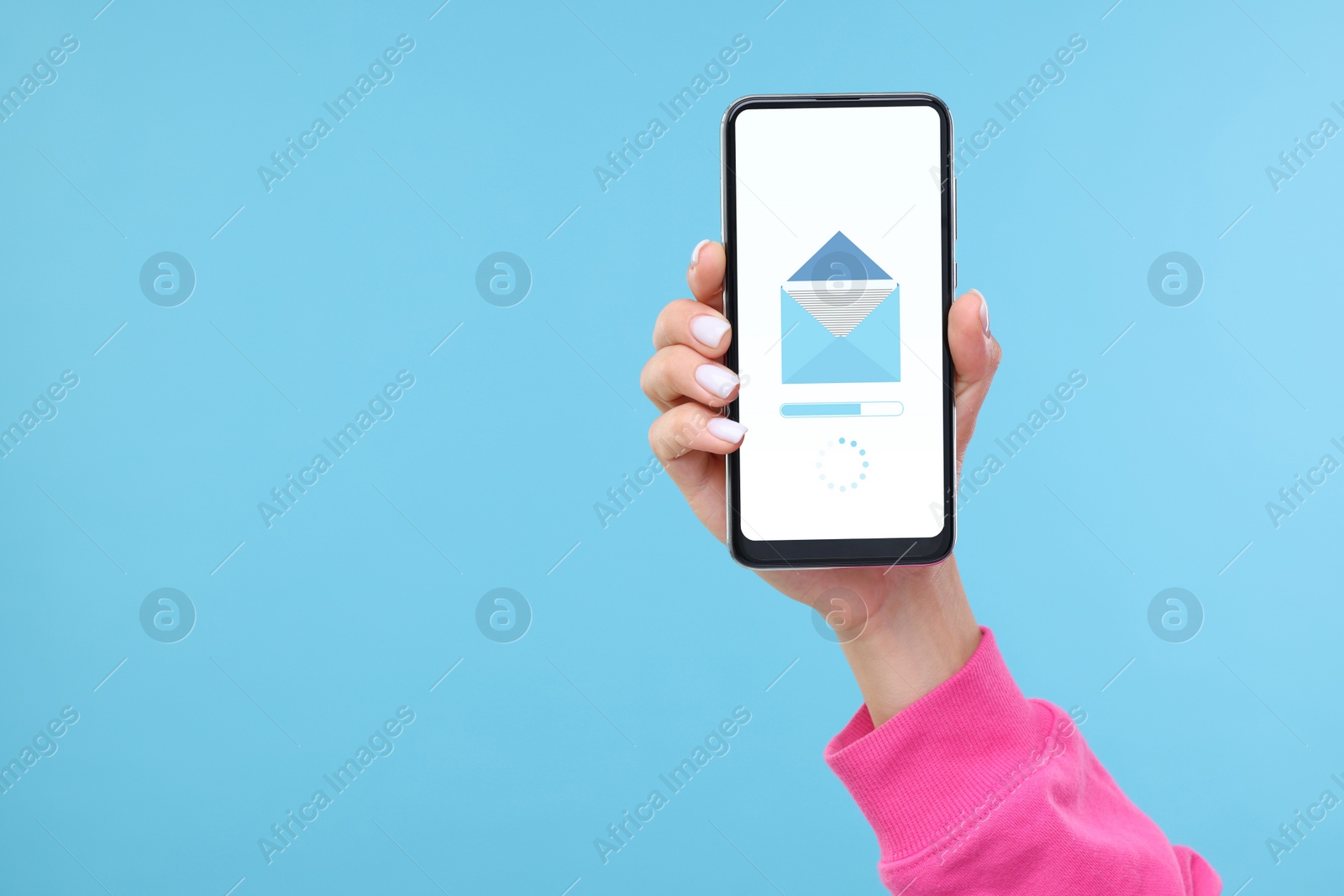 Image of Got new message. Woman holding smartphone on light blue background, closeup. Space for text