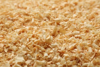 Dry natural sawdust as background, closeup view