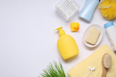 Photo of Different baby bath accessories and cosmetic products on white background, flat lay. Space for text