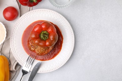 Photo of Delicious stuffed bell pepper served on light table, flat lay. Space for text