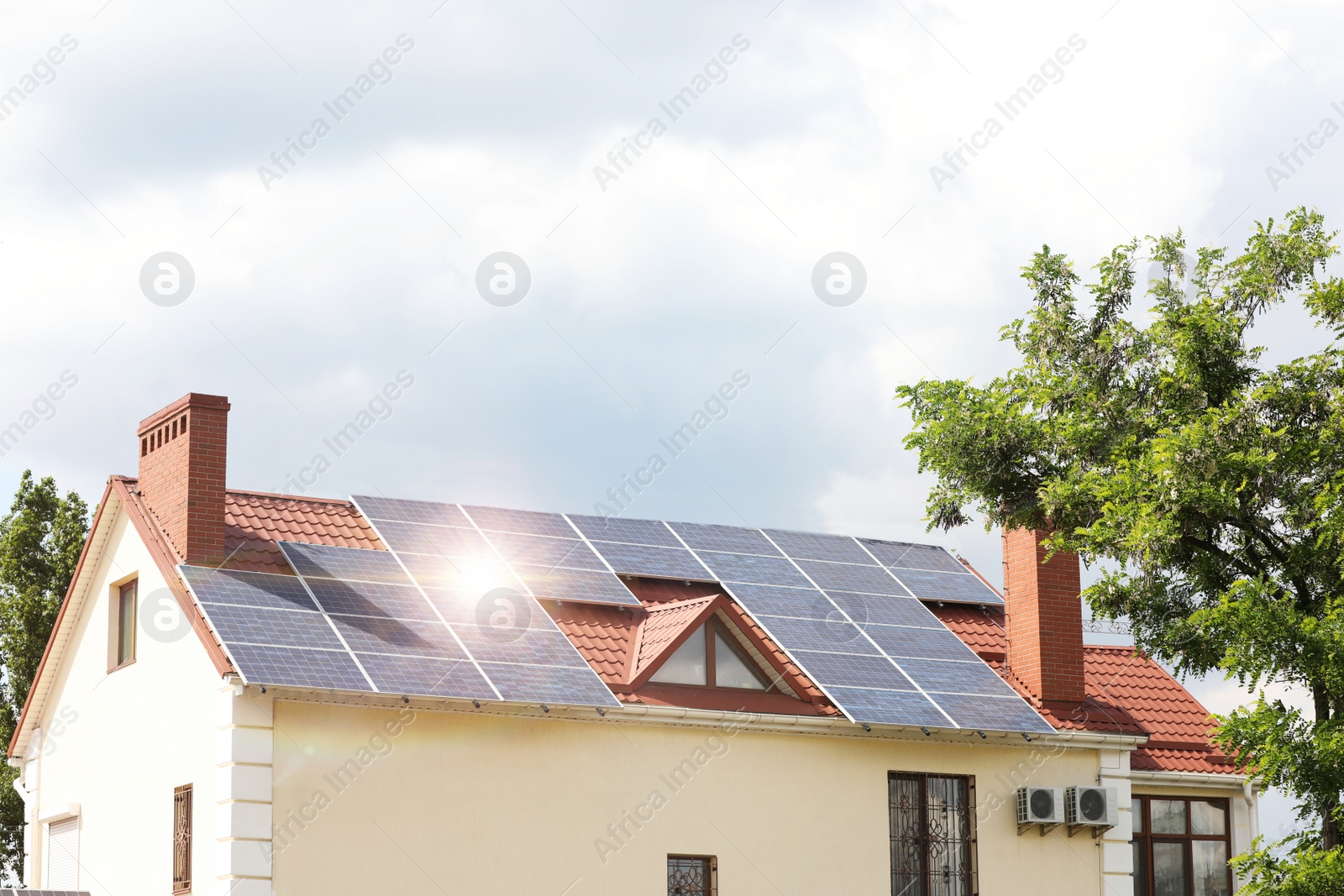 Photo of Building with installed solar panels on roof. Alternative energy source