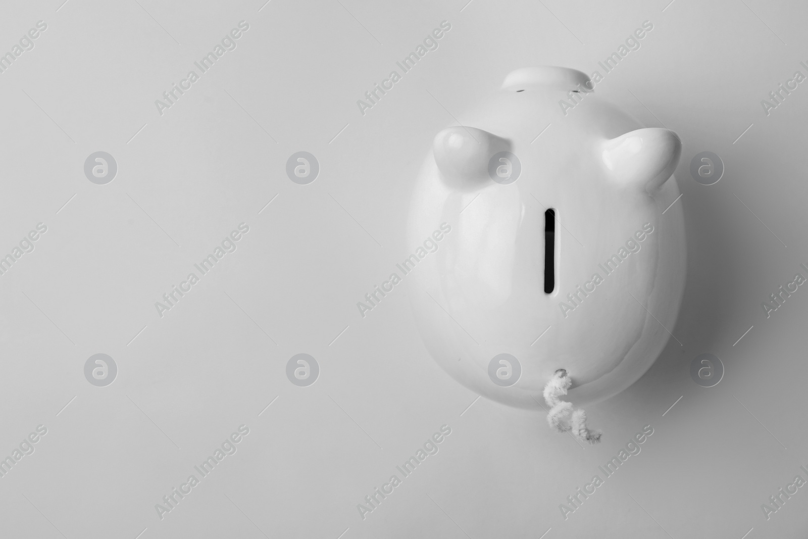 Photo of Cute piggy bank on white background, top view