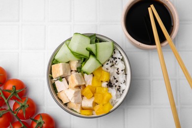 Photo of Delicious poke bowl with meat, rice and vegetables served on white table, flat lay