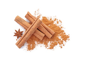 Photo of Aromatic cinnamon sticks and powder on white background