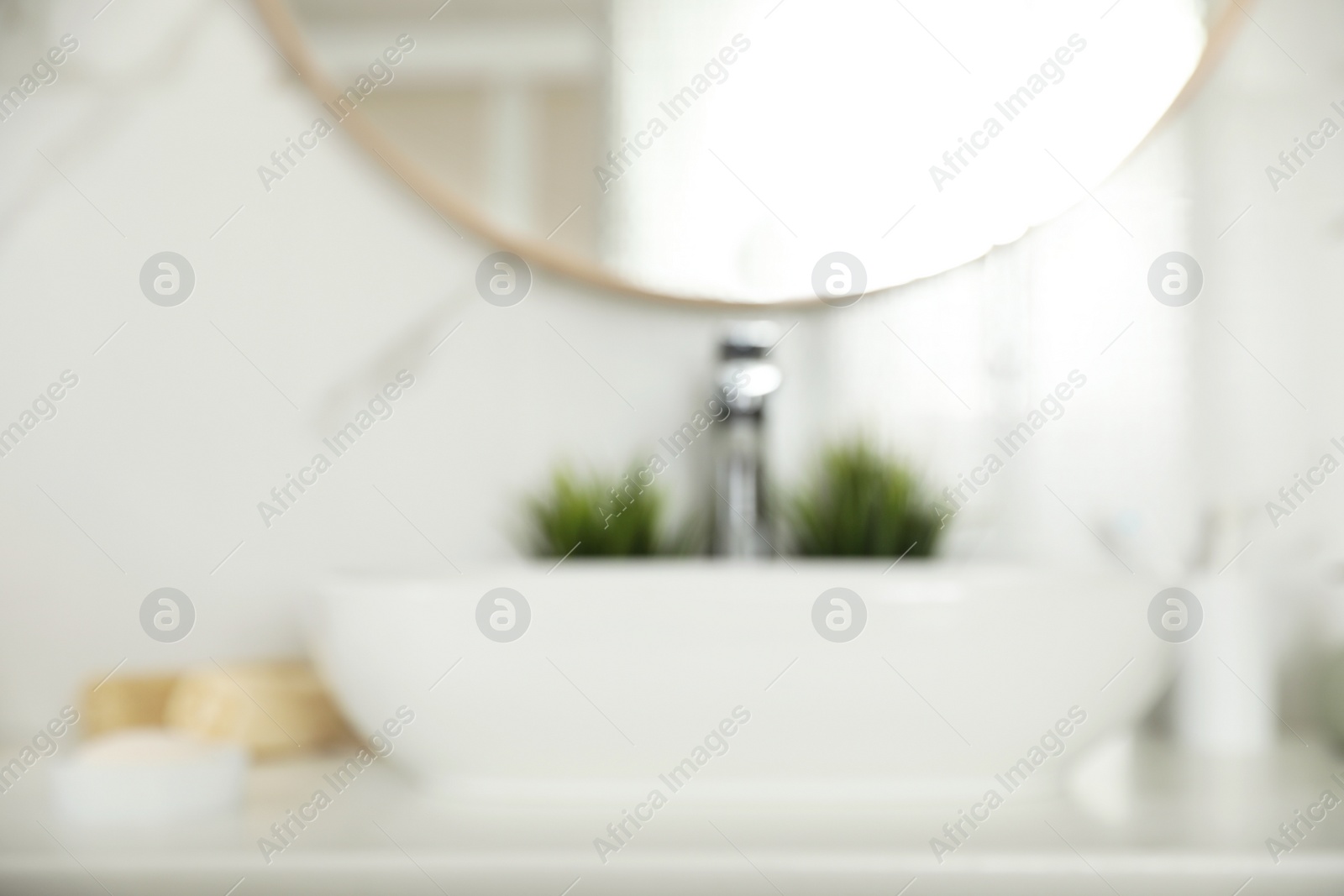 Photo of Blurred view of stylish modern bathroom with mirror