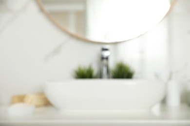 Blurred view of stylish modern bathroom with mirror