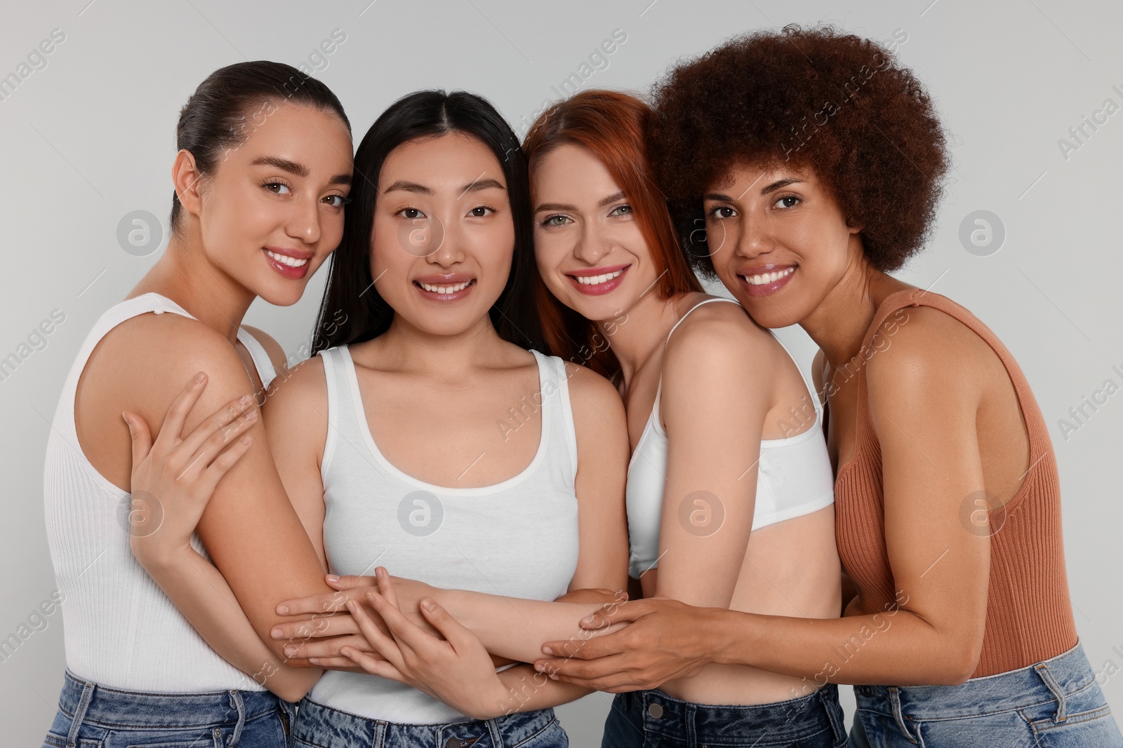 Photo of Portrait of beautiful young women on light grey background