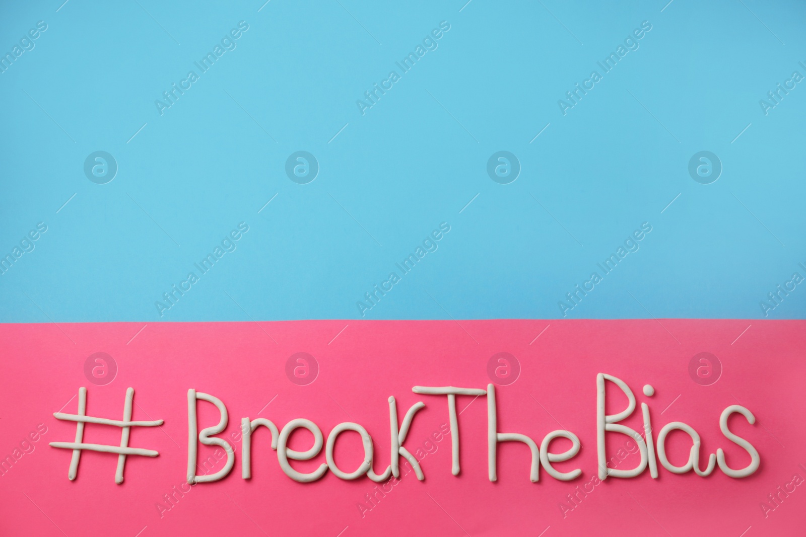 Photo of Hashtag BreakTheBias made of modeling clay on color background, top view. Space for text