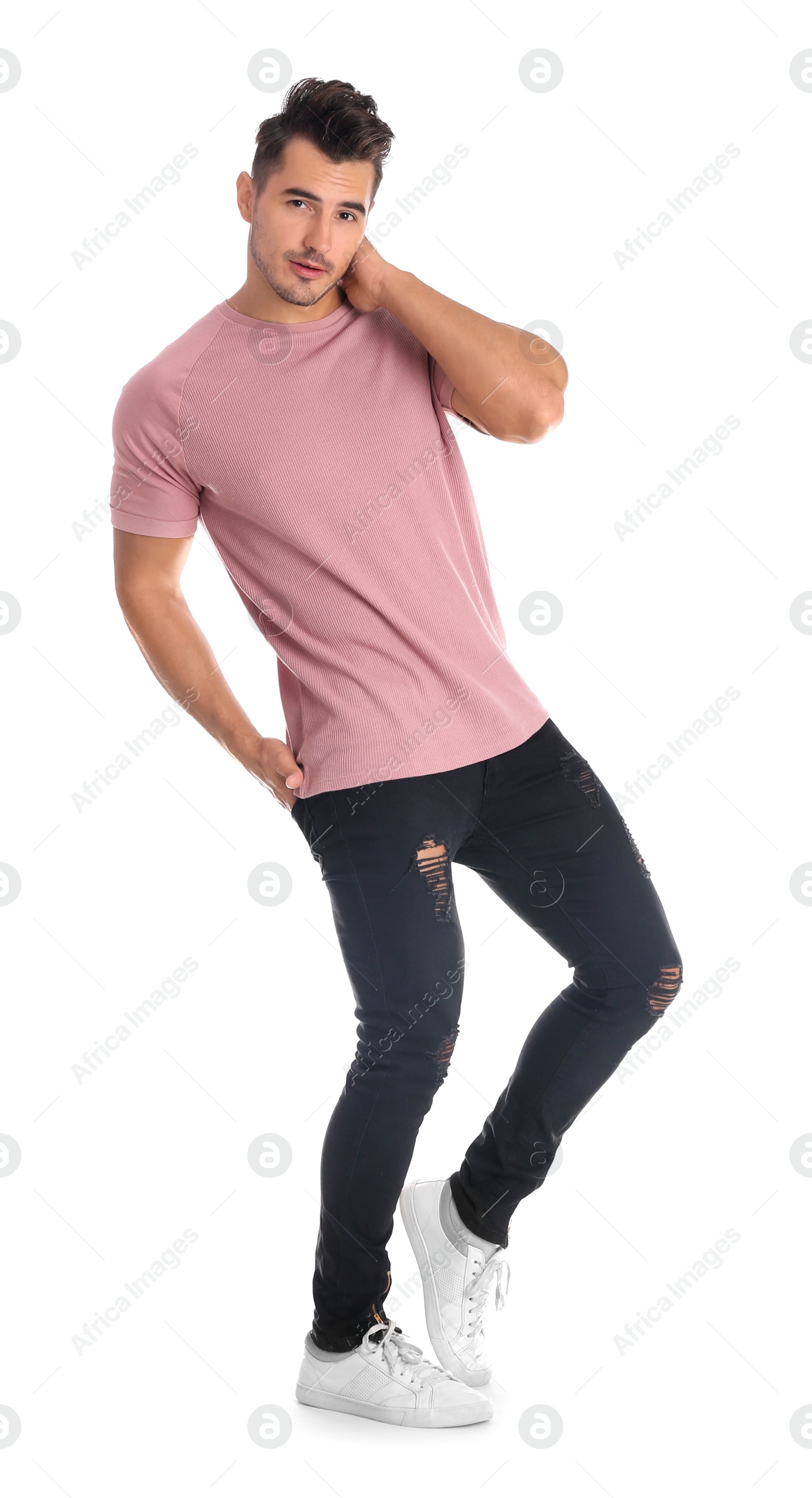 Photo of Young man in stylish jeans on white background