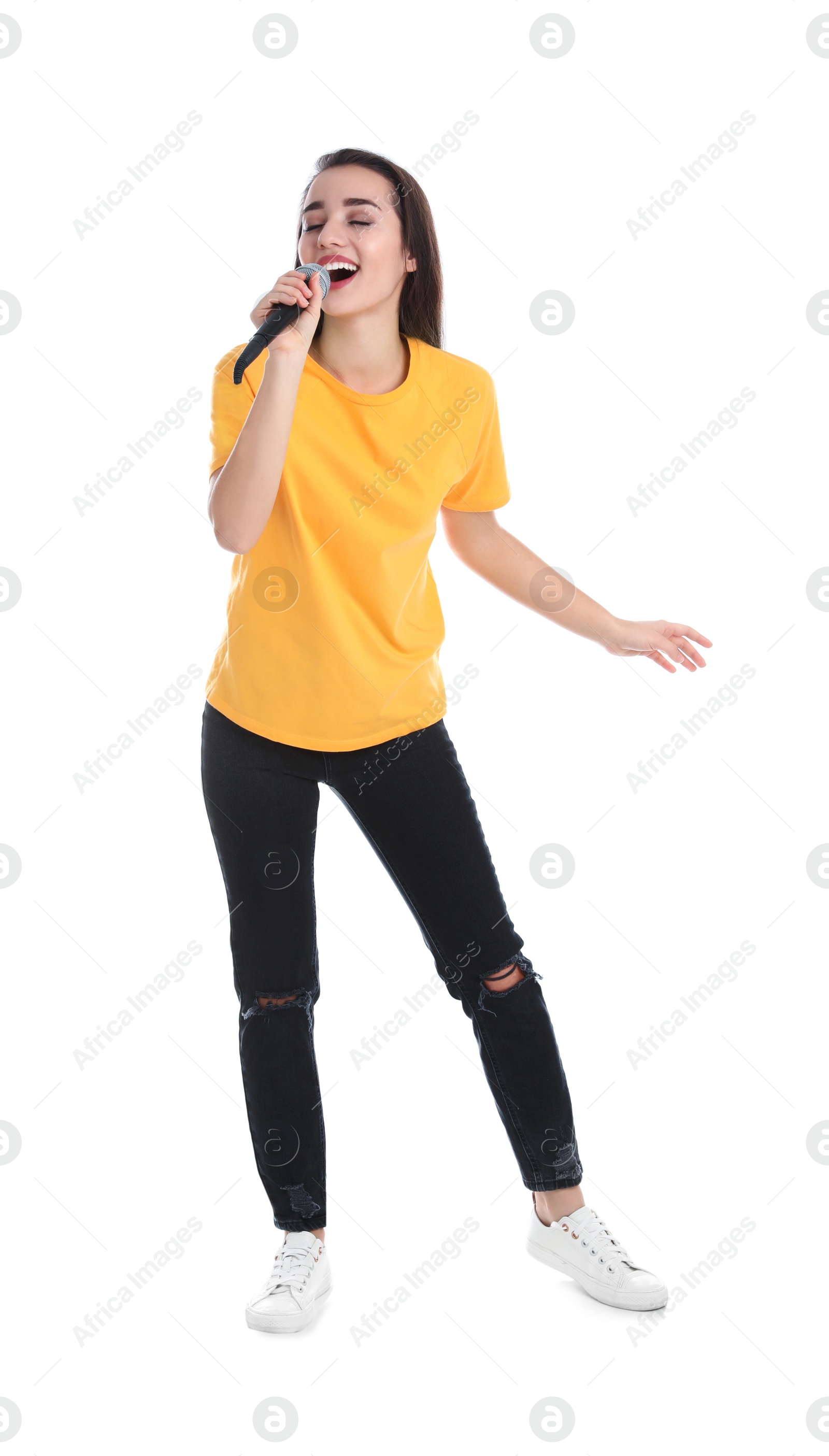 Photo of Young woman wearing casual clothes singing in microphone on white background