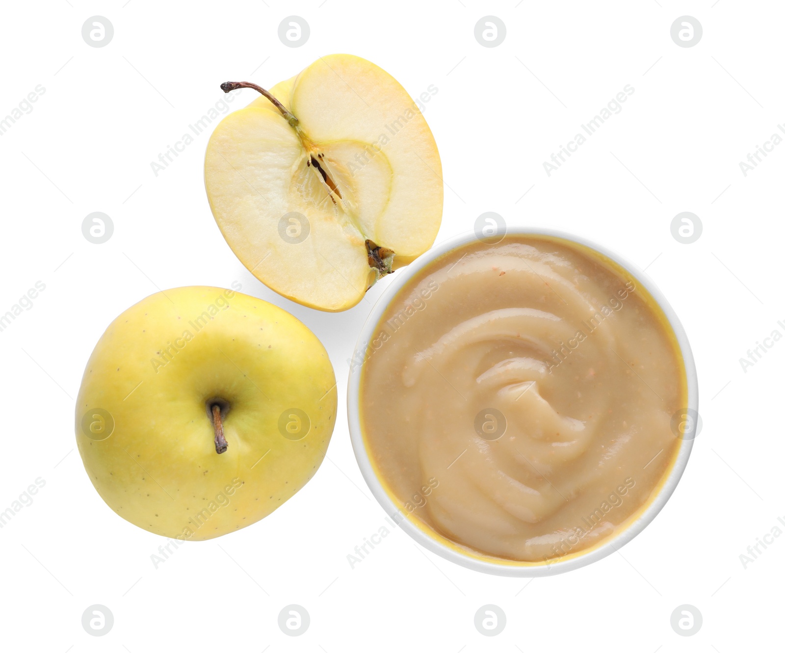 Photo of Apple puree in bowl and fresh fruits on white background, top view