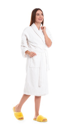 Photo of Young woman in bathrobe on white background