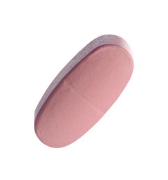 Photo of One pink pill isolated on white. Medicinal treatment