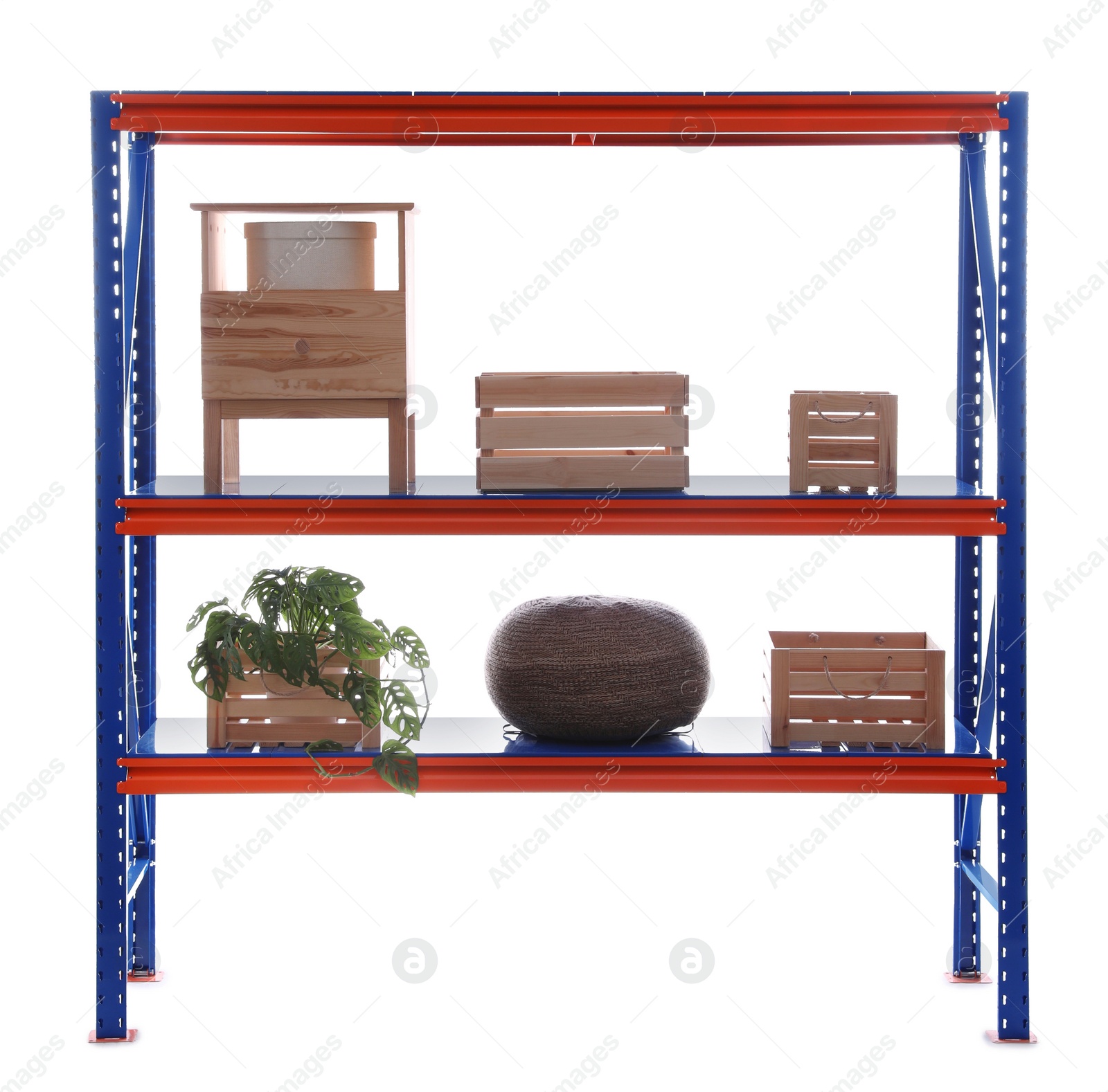 Photo of Bright metal shelving unit with wooden crates and houseplant on white background