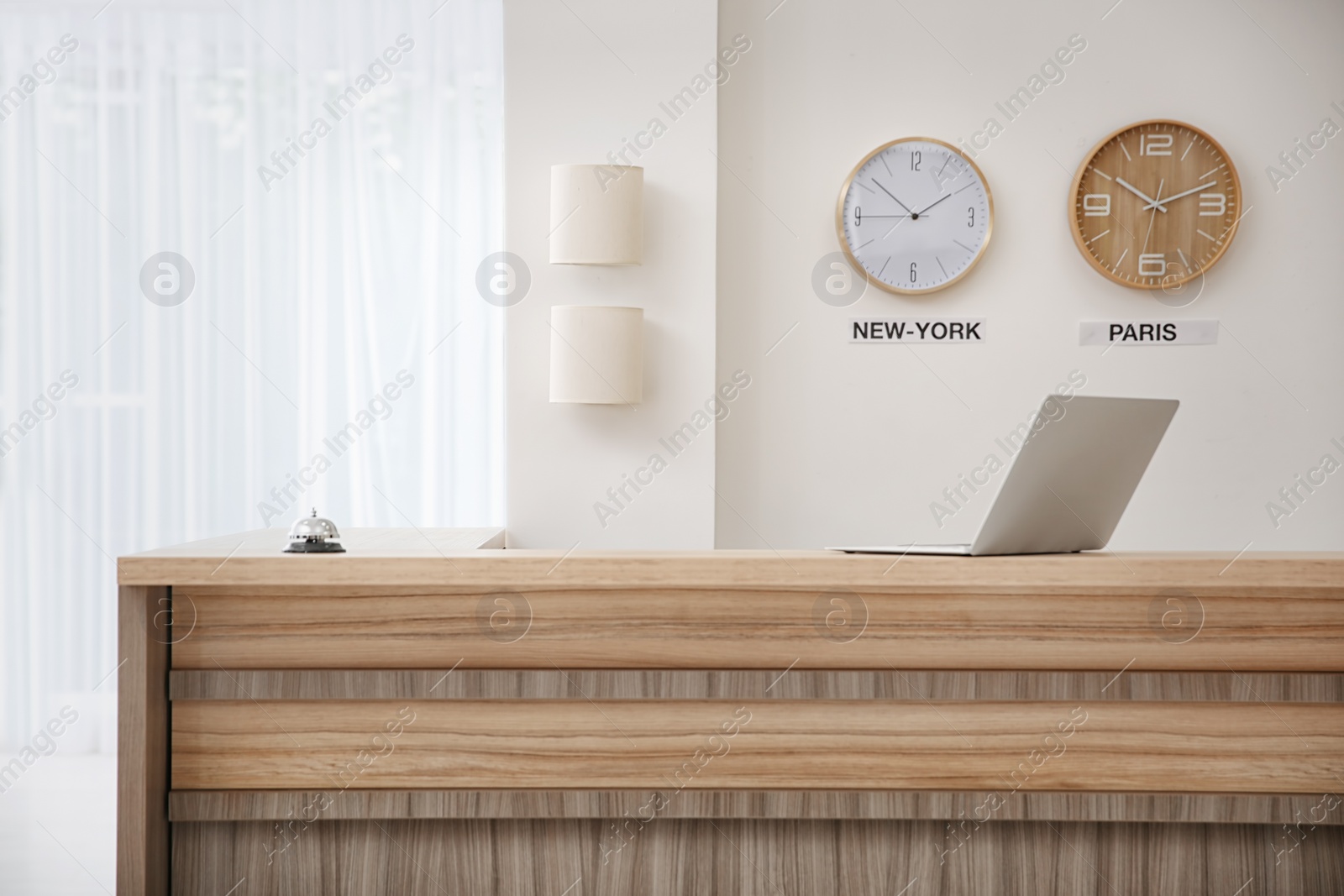 Photo of Receptionist desk in hotel. Workplace interior