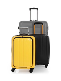 Modern suitcases for travelling on white background