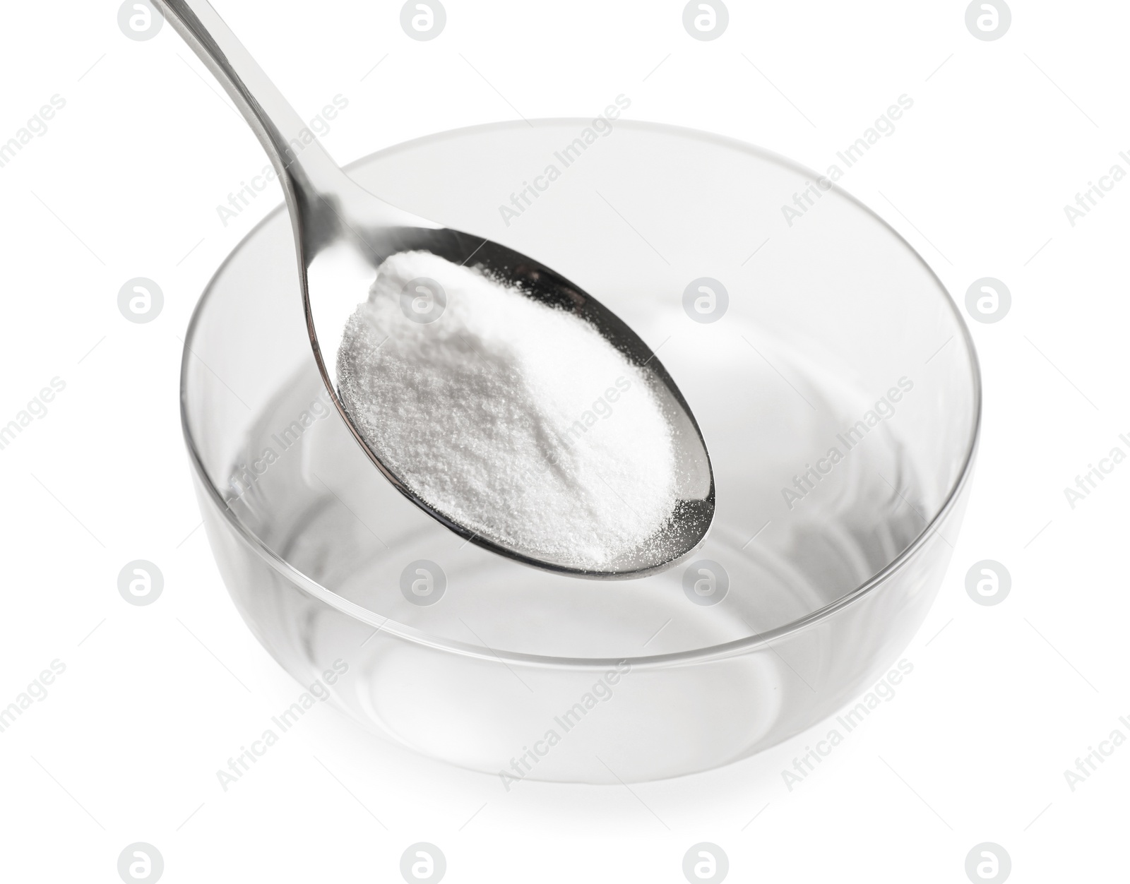 Photo of Spoon with baking soda over glass of water on light background, closeup