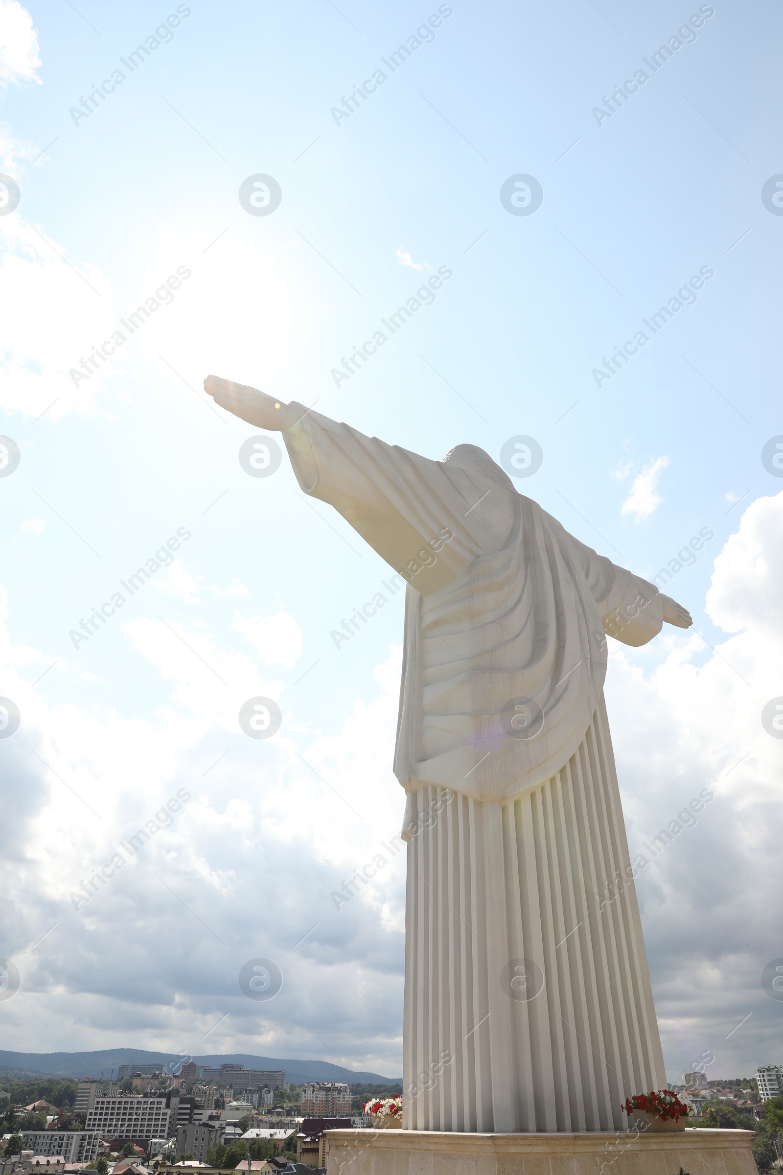 Photo of Truskavets, Ukraine - July 22, 2023: Statue of Christ the Redeemer against beautiful cityscape