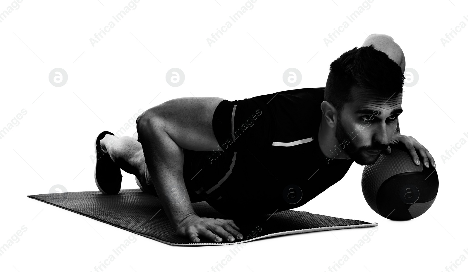 Image of Athletic man doing exercise with medicine ball isolated on white