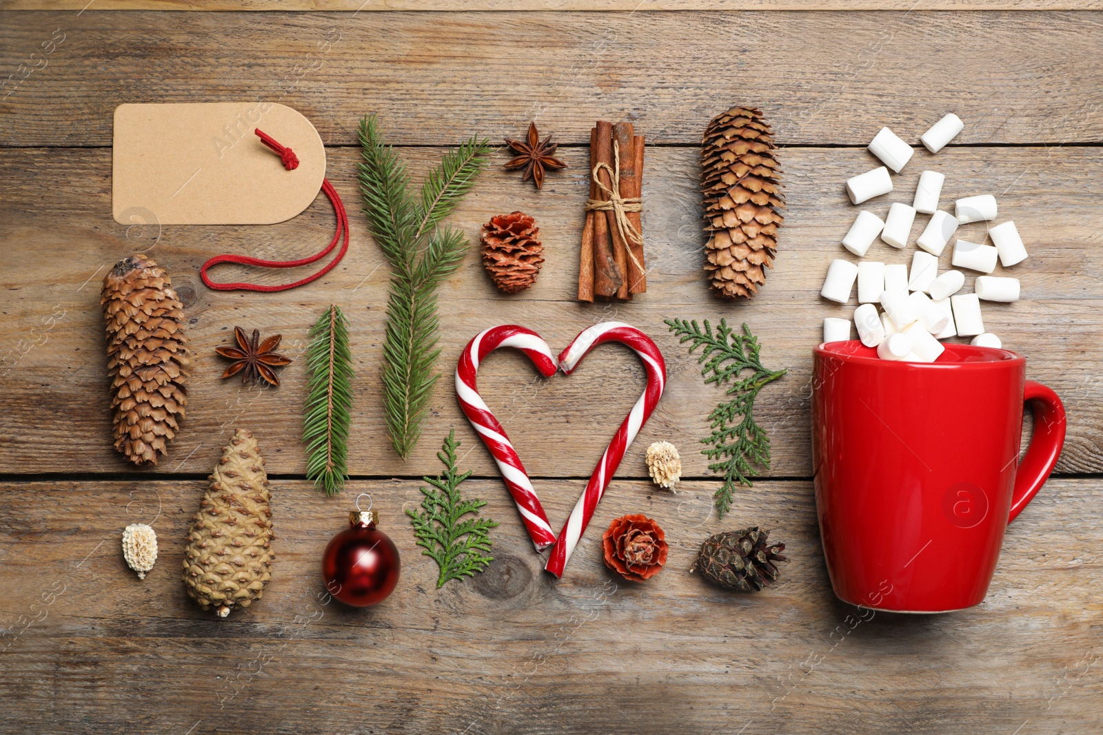 Photo of Flat lay composition with pinecones on wooden background