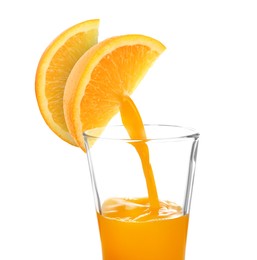 Image of Making orange fresh. Juice pouring from orange citrus slices into glass on white background