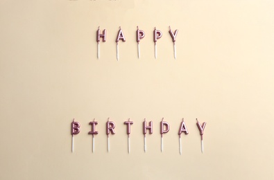 Flat lay composition with birthday candles on color background. Space for text