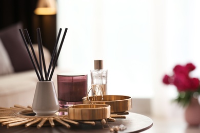 Photo of Composition with stylish accessories and interior elements on table indoors