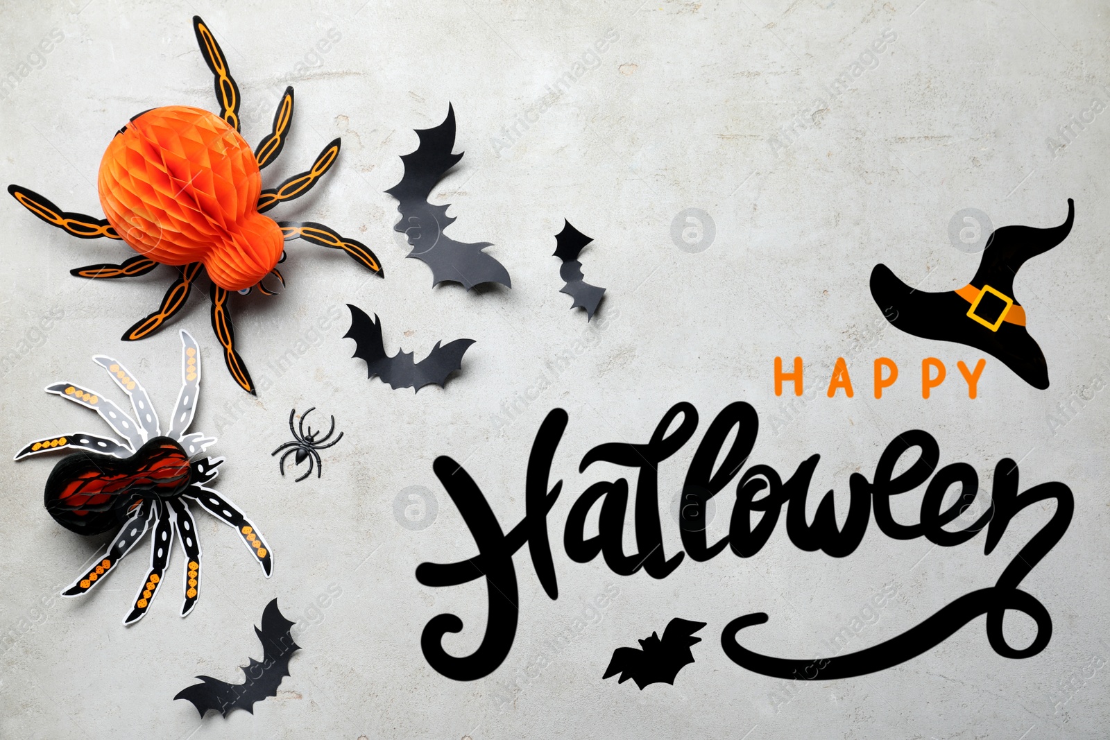 Image of Halloween decor elements on light grey background, flat lay