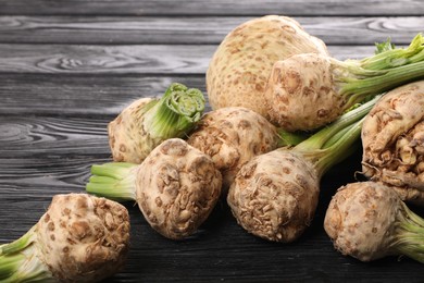 Fresh raw celery roots black wooden table