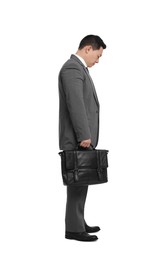 Photo of Tired businessman with briefcase posing on white background