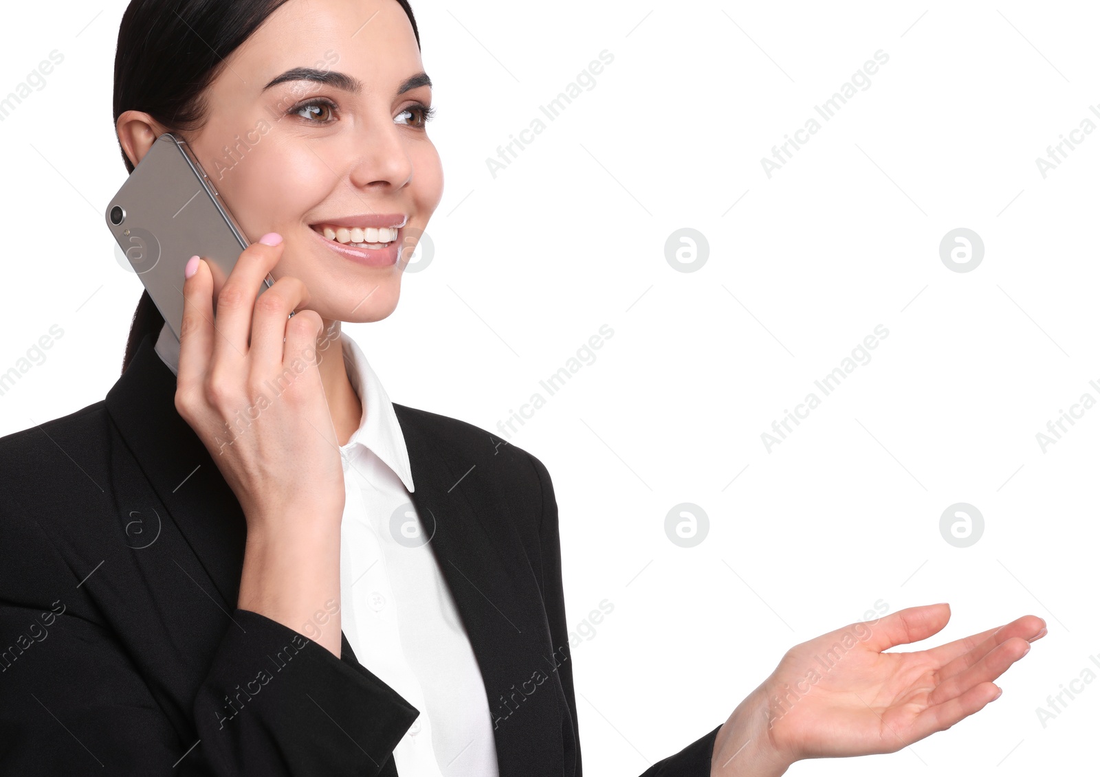 Photo of Young businesswoman talking on mobile phone against white background