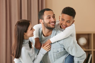 Happy international family spending time together at home